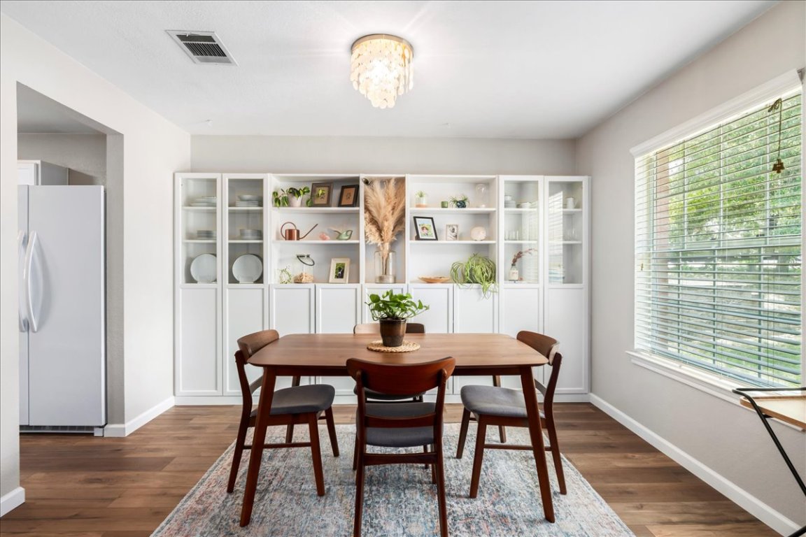 a dining room with furniture and window