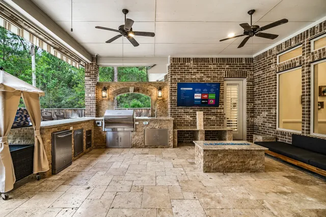 a front view of a house with a big yard and trees