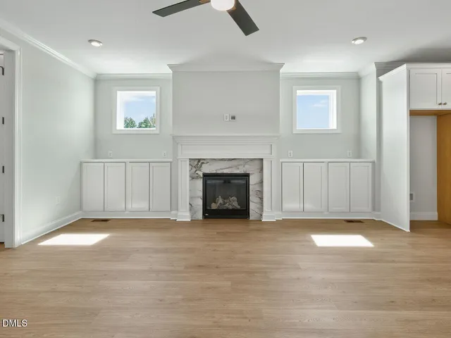 a kitchen with granite countertop a sink and cabinets
