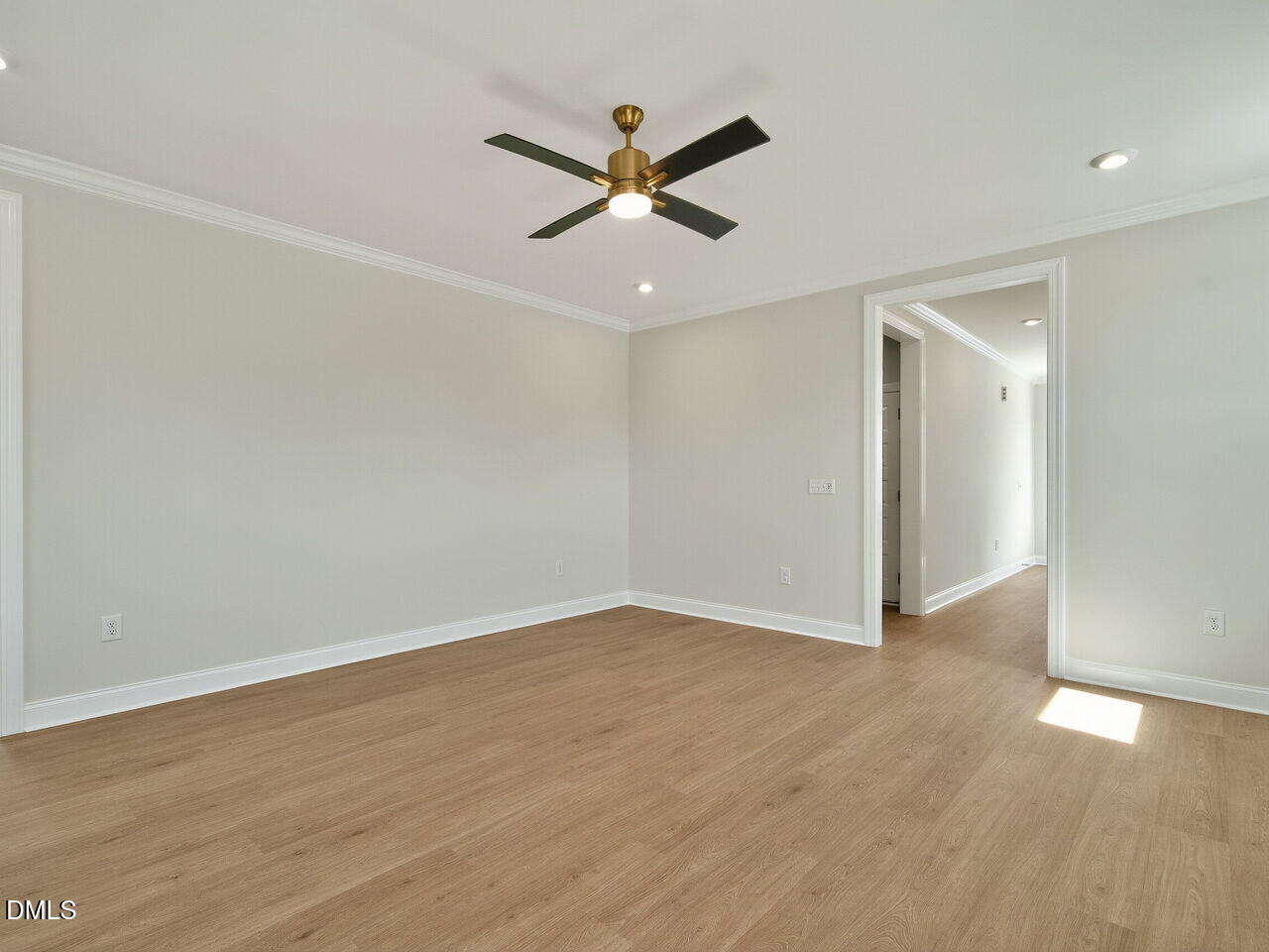 1209 Barreto Drive Wendell, NC 27591 - Photo 7 of 47 an empty room with wooden floor and ceiling fan