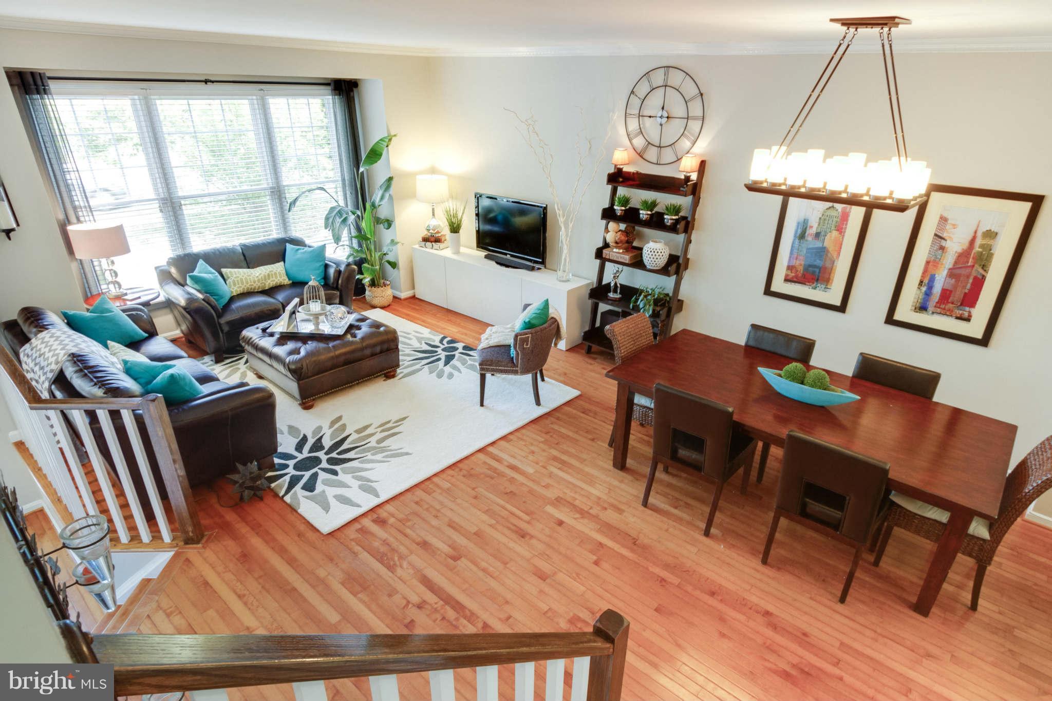 1281 Weatherstone Court Reston, VA 20194 - Photo 14 of 29 a living room with furniture fireplace and a large window