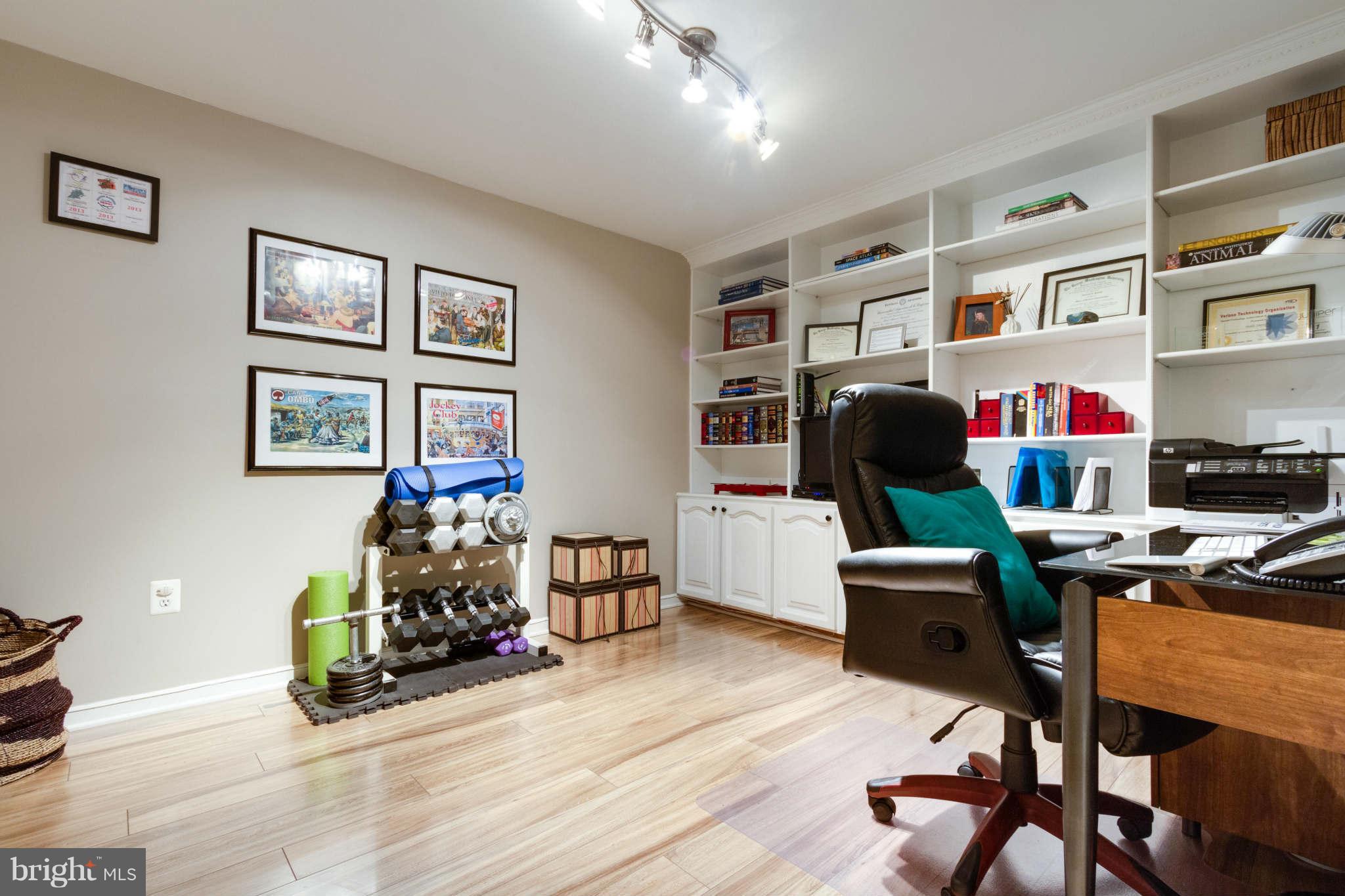 1281 Weatherstone Court Reston, VA 20194 - Photo 22 of 29 a view of a livingroom with workspace and a couch