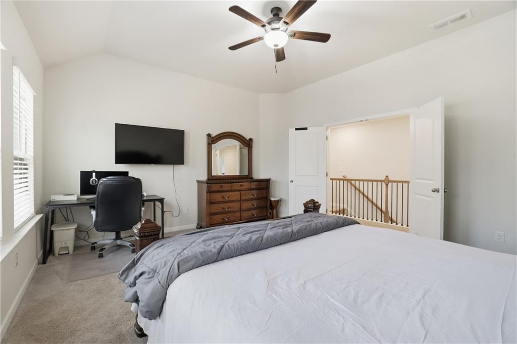 175 Paxton Lane Jefferson, GA 30549 - Photo 22 of 39 a bedroom with a bed window and a flat screen tv