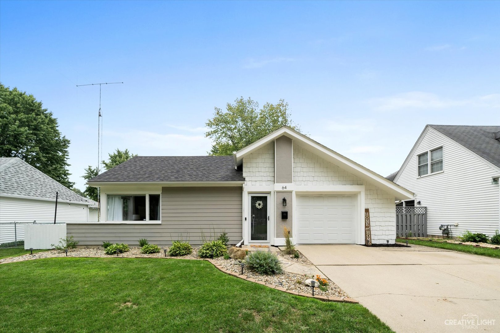 64 Ingleshire Road Montgomery, IL 60538 - Photo 1 of 1 a front view of a house with a yard and garage