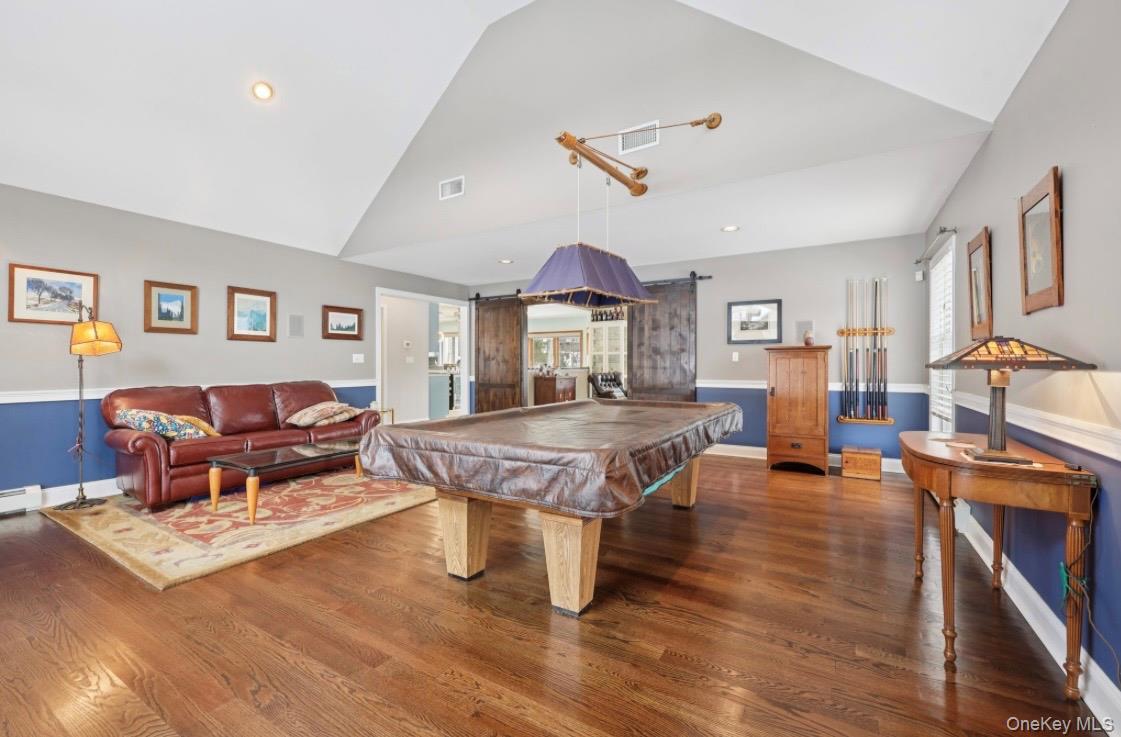 7 Gooler Court Stony Point, NY 10980 - Photo 18 of 35 Recreation room with pool table, a barn door, recessed lighting, wood finished floors, and high vaulted ceiling