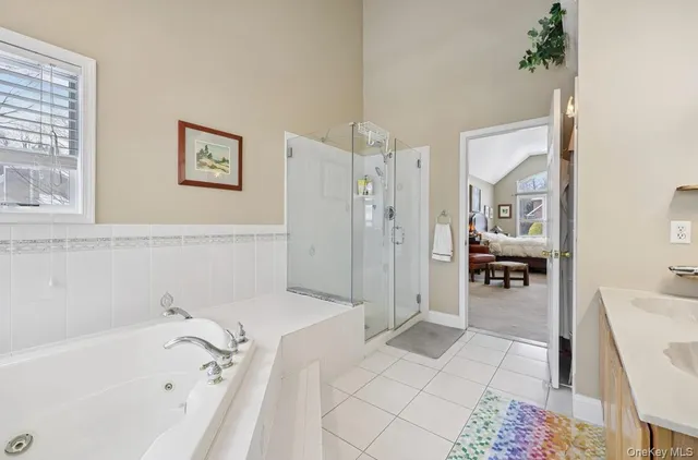 a bathroom with a bathtub and a shower