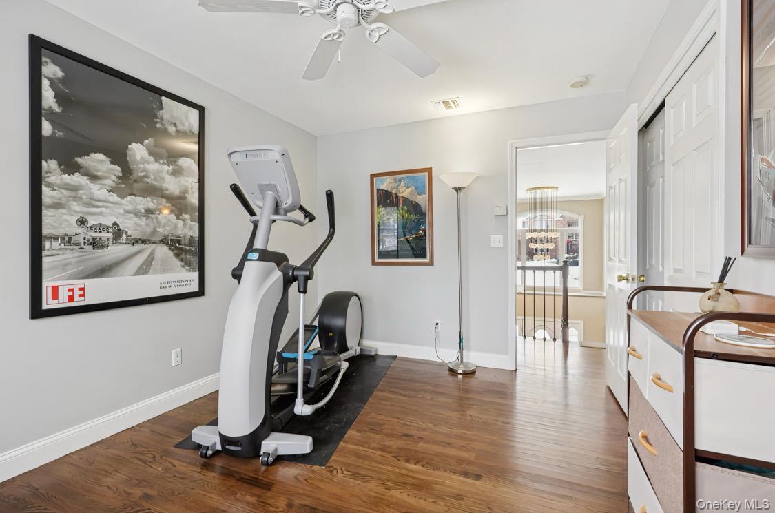 7 Gooler Court Stony Point, NY 10980 - Photo 24 of 35 Exercise area with dark wood-style floors and ceiling fan