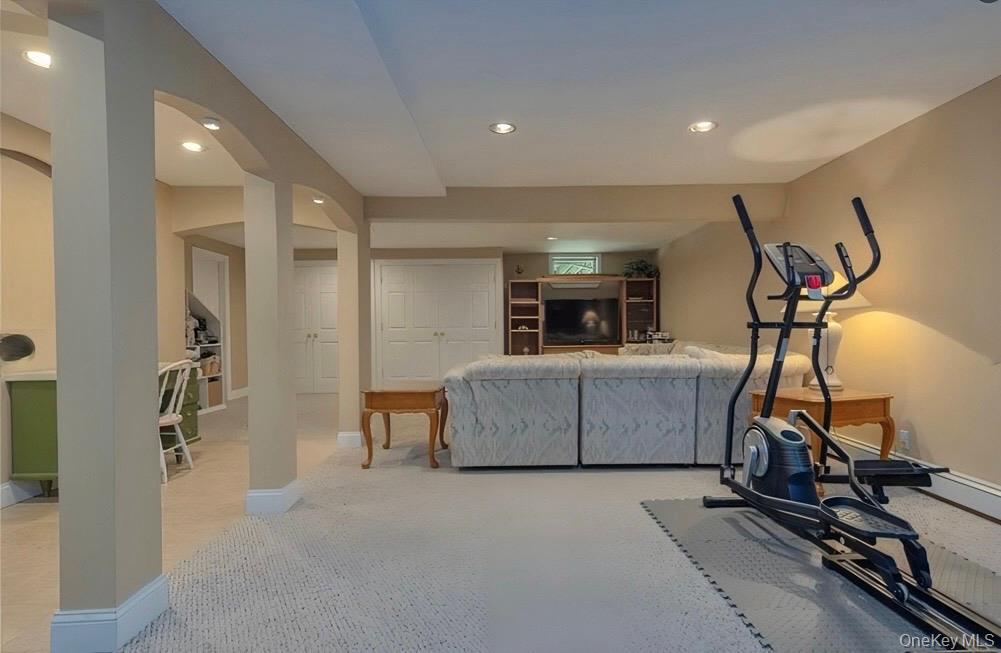 7 Gooler Court Stony Point, NY 10980 - Photo 28 of 35 Exercise room featuring arched walkways, recessed lighting, and light colored carpet