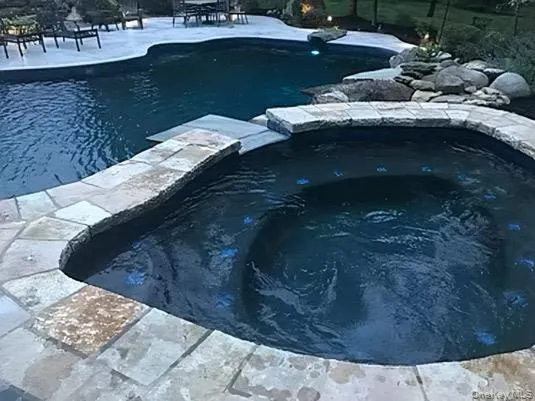 a view of swimming pool with a yard