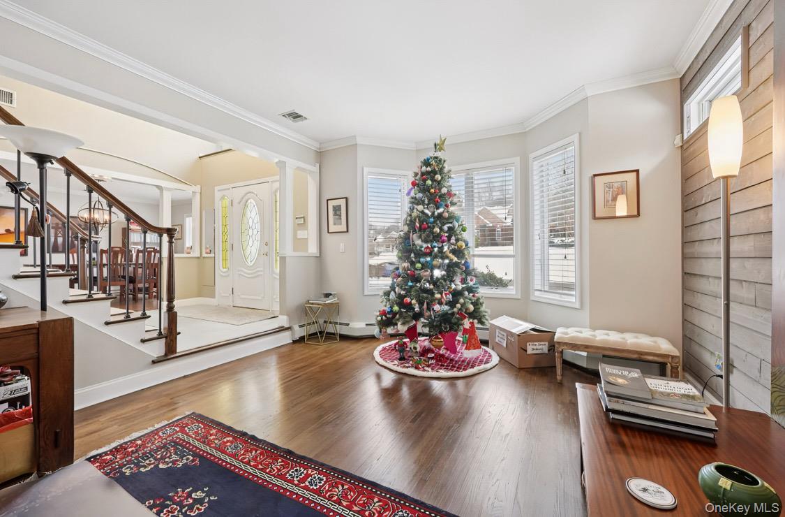 7 Gooler Court Stony Point, NY 10980 - Photo 6 of 35 Foyer with healthy amount of natural light, ornamental molding, wood finished floors, and stairs