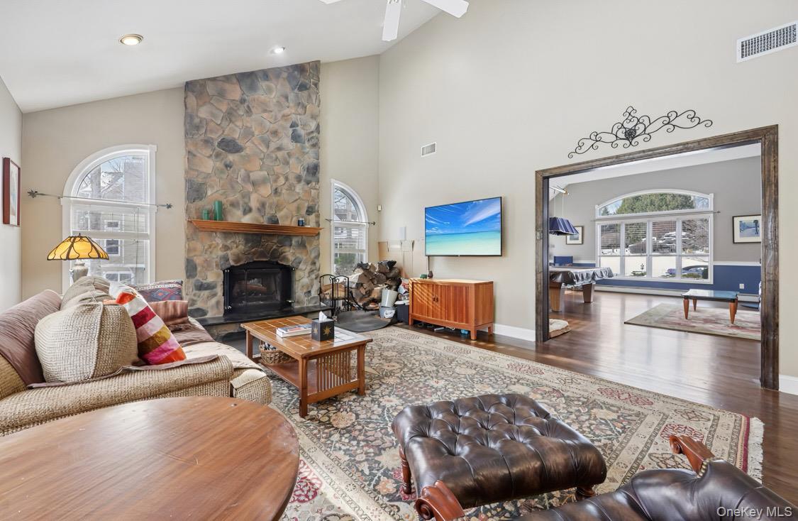 7 Gooler Court Stony Point, NY 10980 - Photo 8 of 35 Living area with a fireplace, plenty of natural light, wood finished floors, and high vaulted ceiling