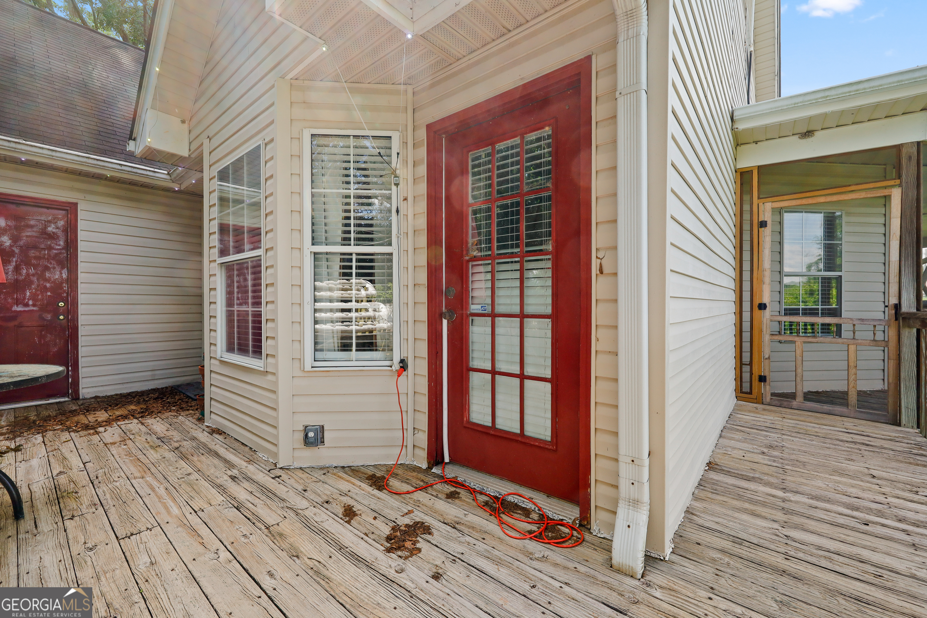2433 Bear Creek Road Statham, GA 30666 - Photo 50 of 58 a view of a house with a door and wooden floor
