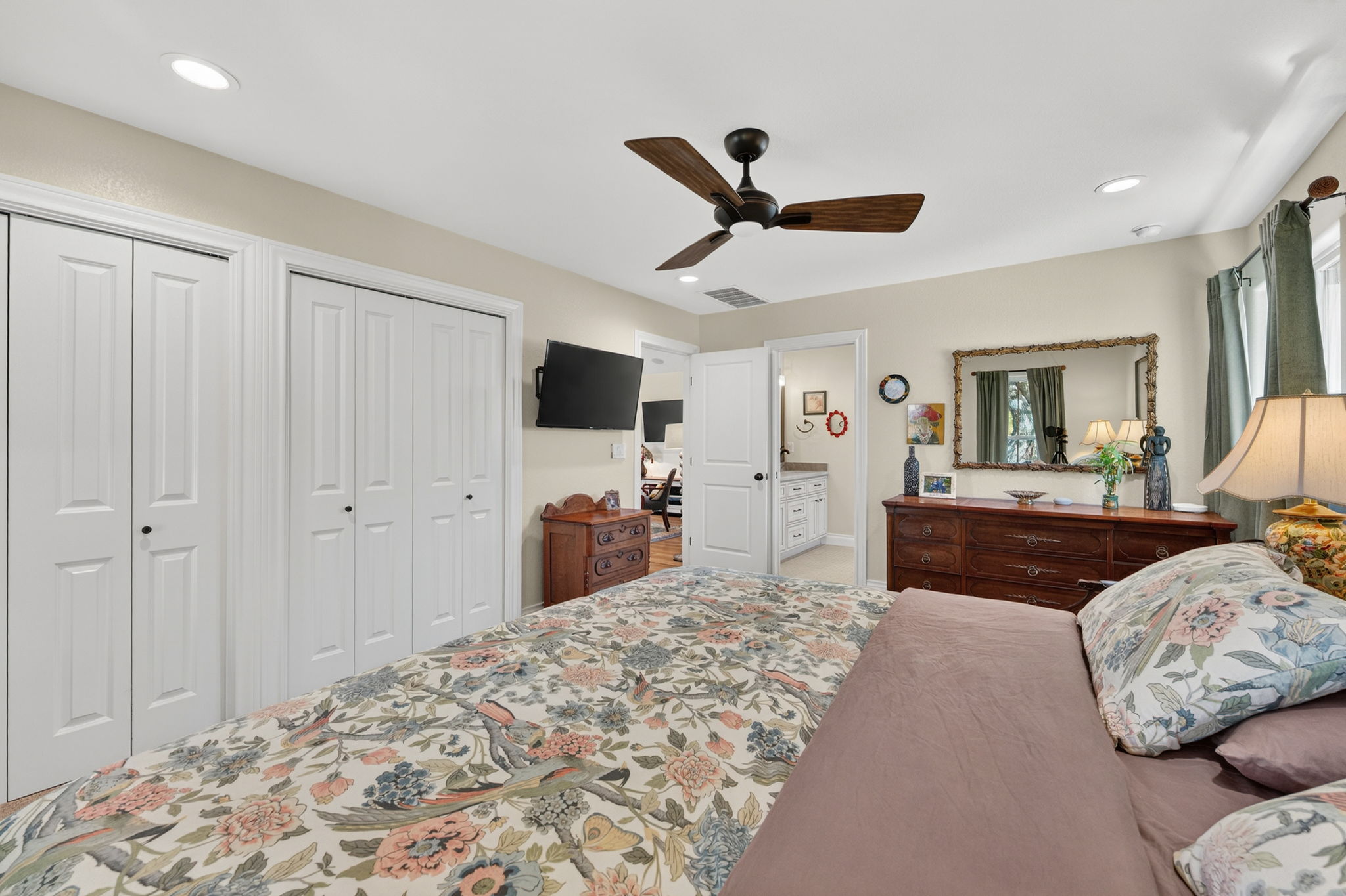 8611 Winding Walk Austin, TX 78757 - Photo 15 of 29 There are dual bifold closets for ample storage and a an ensuite bathroom.