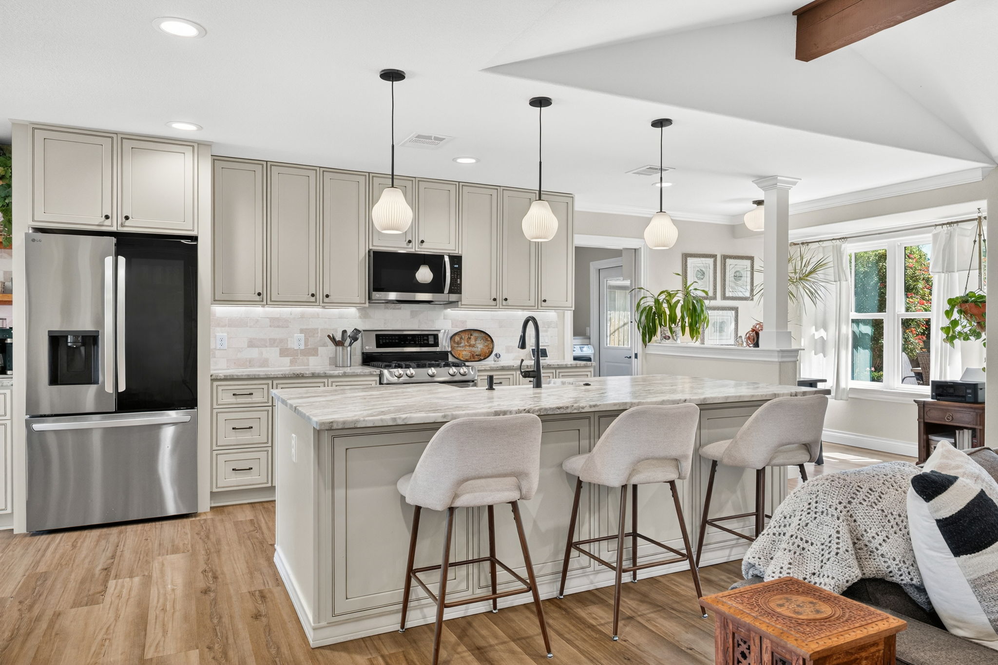 8611 Winding Walk Austin, TX 78757 - Photo 8 of 29 This kitchen is a showstopper! The massive center island with leathered dolomite countertops provides ample prep space and a social hub with seating.