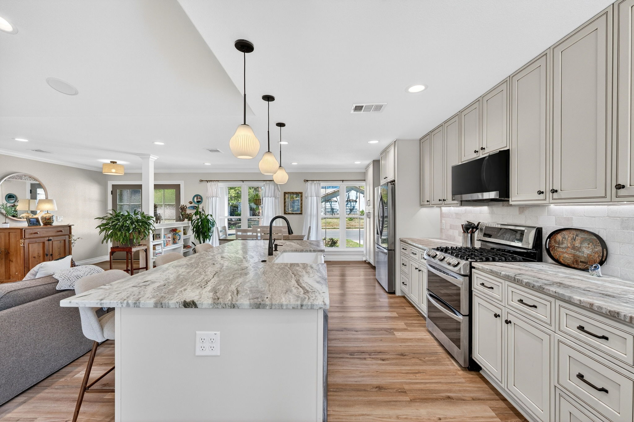8611 Winding Walk Austin, TX 78757 - Photo 10 of 29 The natural wood-look flooring provides a warm contrast to the bright, crisp interior.