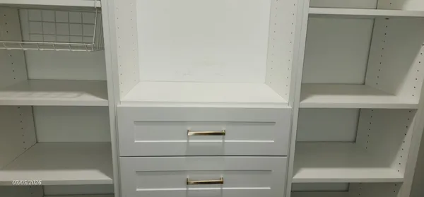 a white toilet sitting next to a bathroom sink
