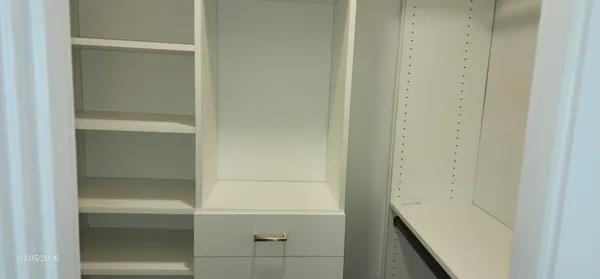 a view of wooden floor and a window