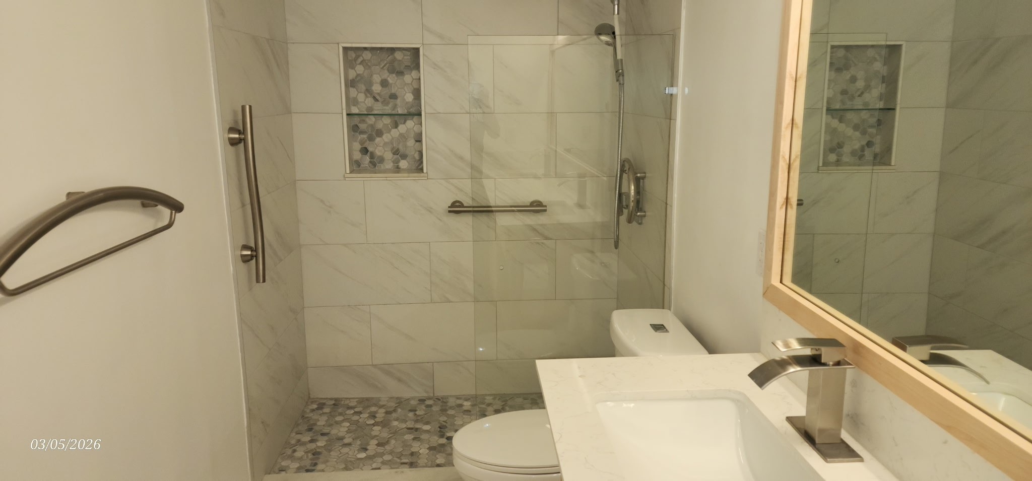 3930 West Alabama Street, Unit 7 Houston, TX 77027 - Photo 19 of 31 a white toilet sitting next to a bathroom sink