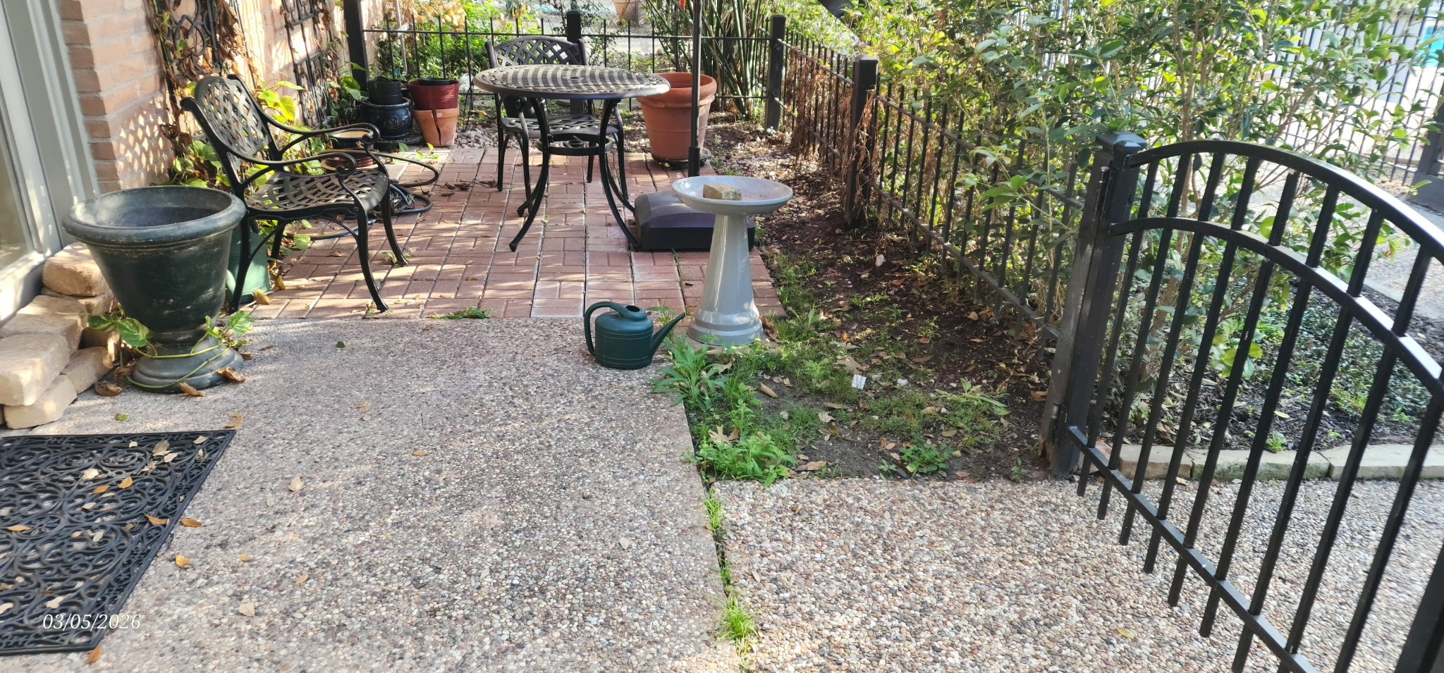 3930 West Alabama Street, Unit 7 Houston, TX 77027 - Photo 27 of 31 a view of a porch with chairs and potted plants