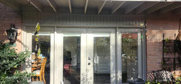 a room with window and a hallway