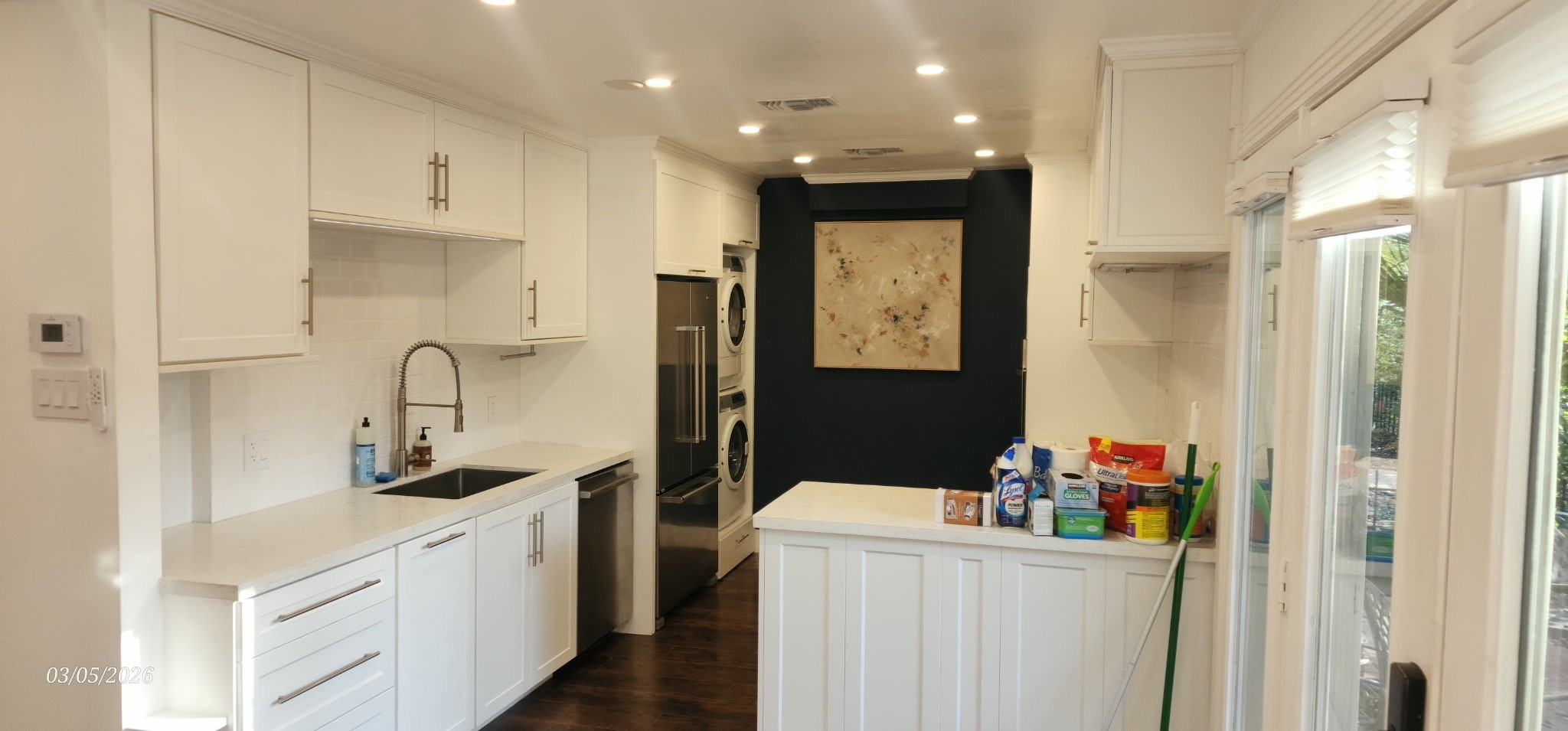 3930 West Alabama Street, Unit 7 Houston, TX 77027 - Photo 5 of 31 a kitchen with a refrigerator and cabinets