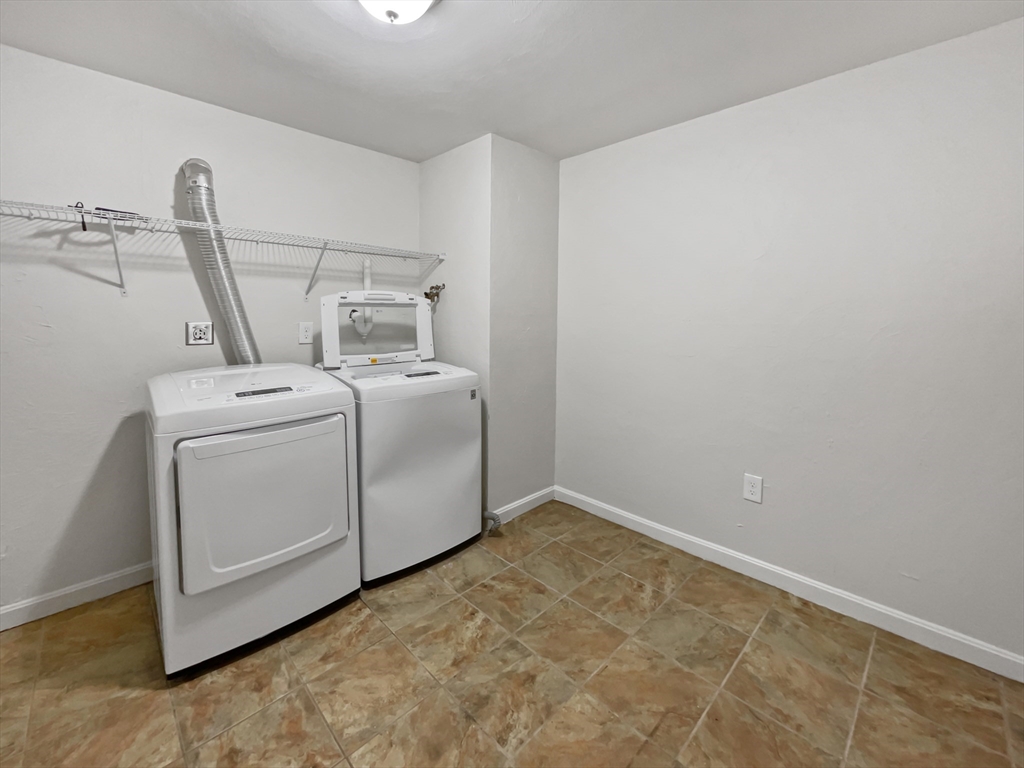 15 Cannongate Road, Unit 48 Tyngsborough, MA 01879 - Photo 20 of 25 a utility room with dryer and washer