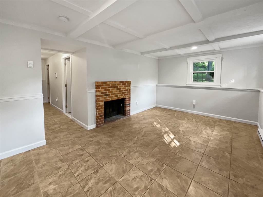 15 Cannongate Road, Unit 48 Tyngsborough, MA 01879 - Photo 24 of 25 a view of livingroom with an empty space and window
