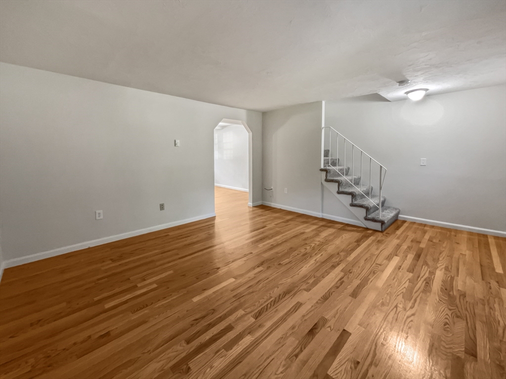 15 Cannongate Road, Unit 48 Tyngsborough, MA 01879 - Photo 3 of 25 a view of empty room with wooden floor