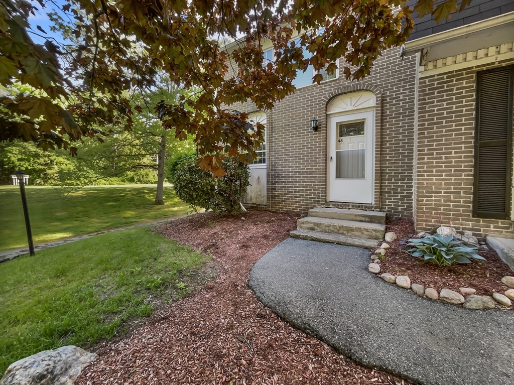 15 Cannongate Road, Unit 48 Tyngsborough, MA 01879 - Photo 8 of 25 a view of a house with backyard and garden