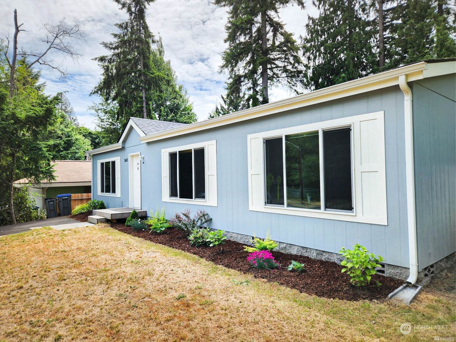 a front view of a house with a yard