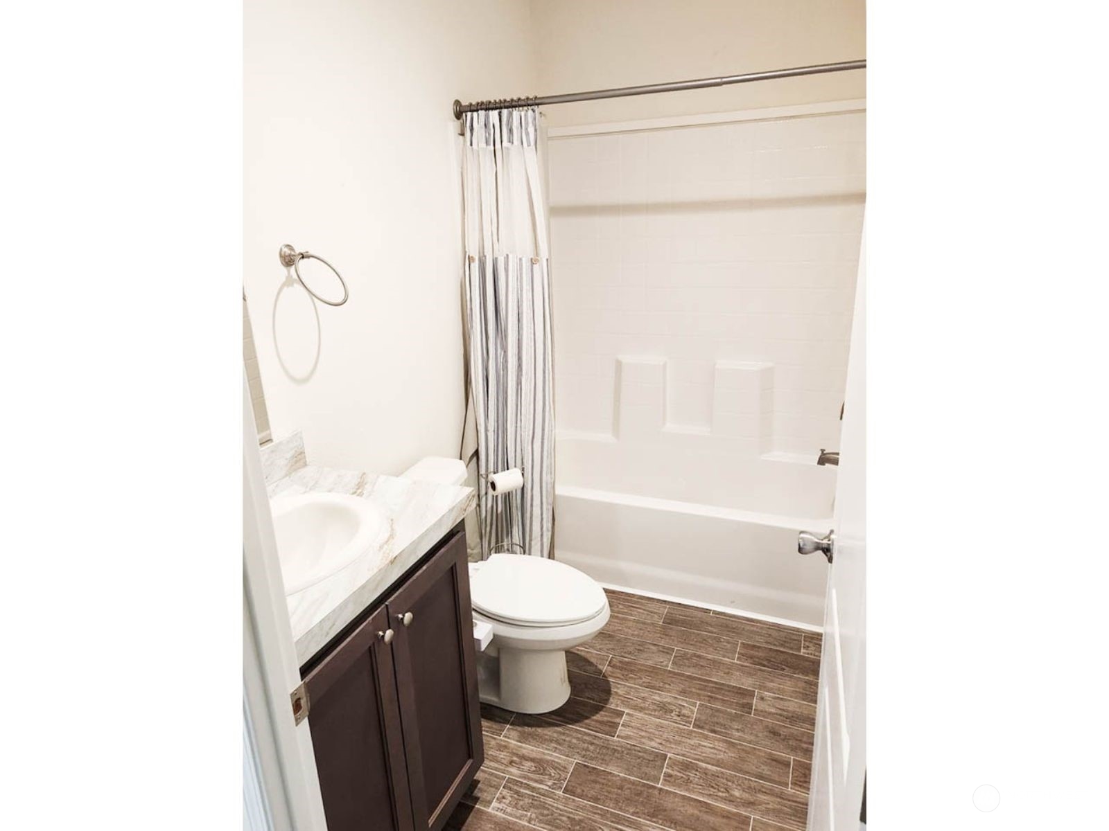 2681 Northeast John Carlson Road Bremerton, WA 98311 - Photo 12 of 15 a bathroom with a granite countertop sink toilet and shower