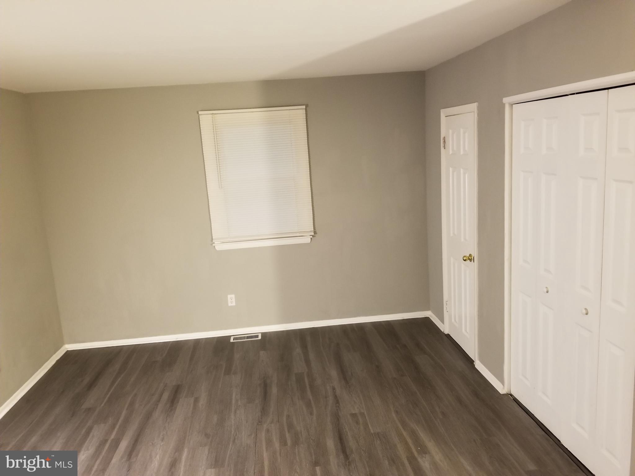 1 Walton Road Mount Holly, NJ 08060 - Photo 13 of 46 an empty room with wooden floor and windows