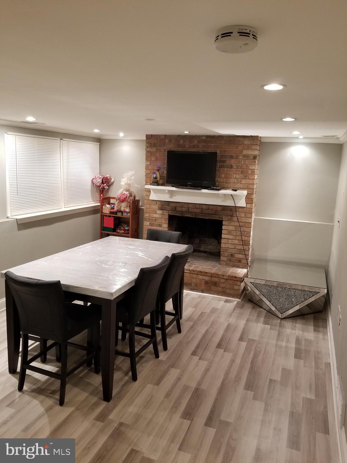 1 Walton Road Mount Holly, NJ 08060 - Photo 23 of 46 a living room with furniture a flat screen tv and a fireplace