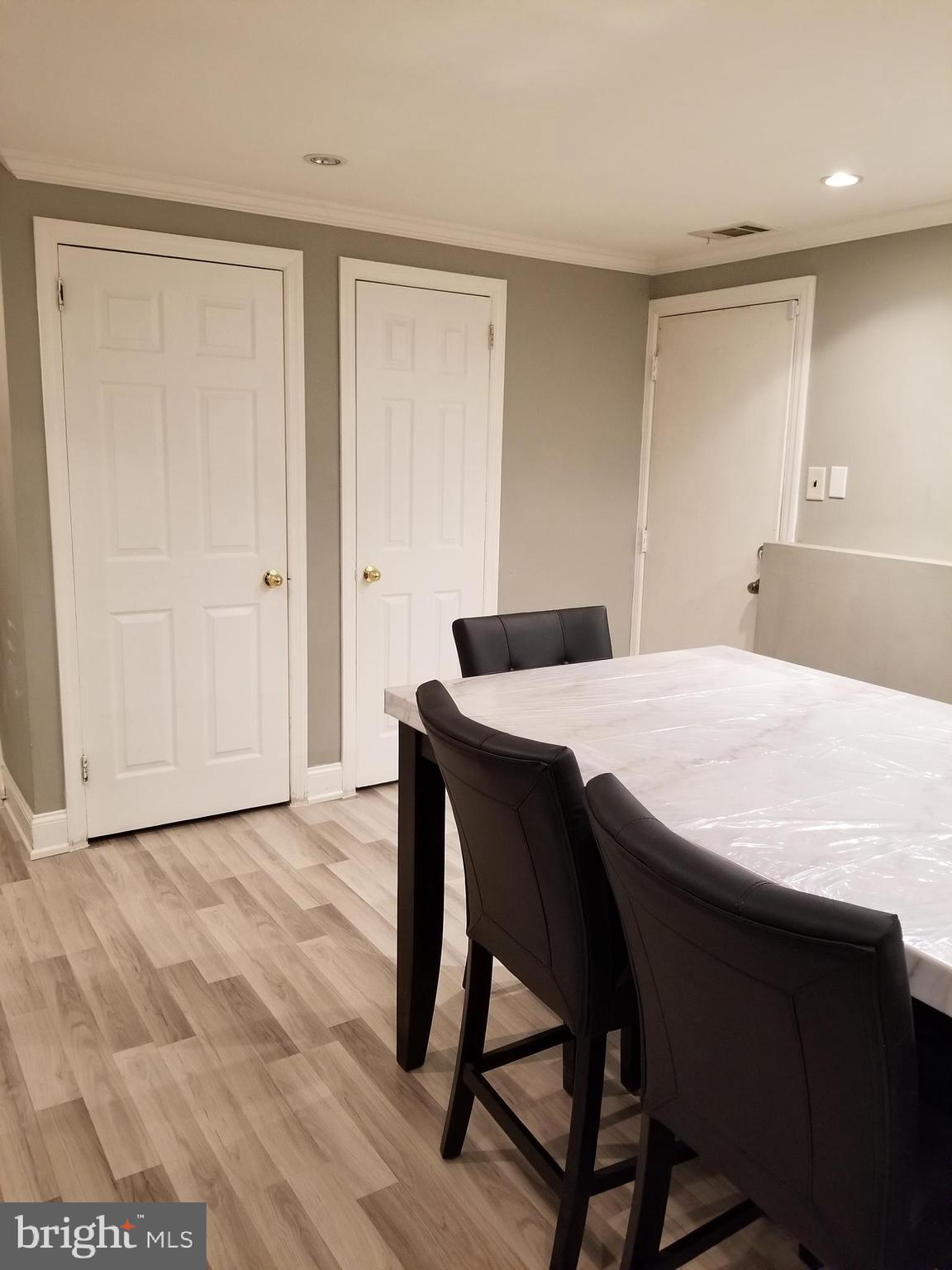 1 Walton Road Mount Holly, NJ 08060 - Photo 26 of 46 a dining room with a wooden table and chairs