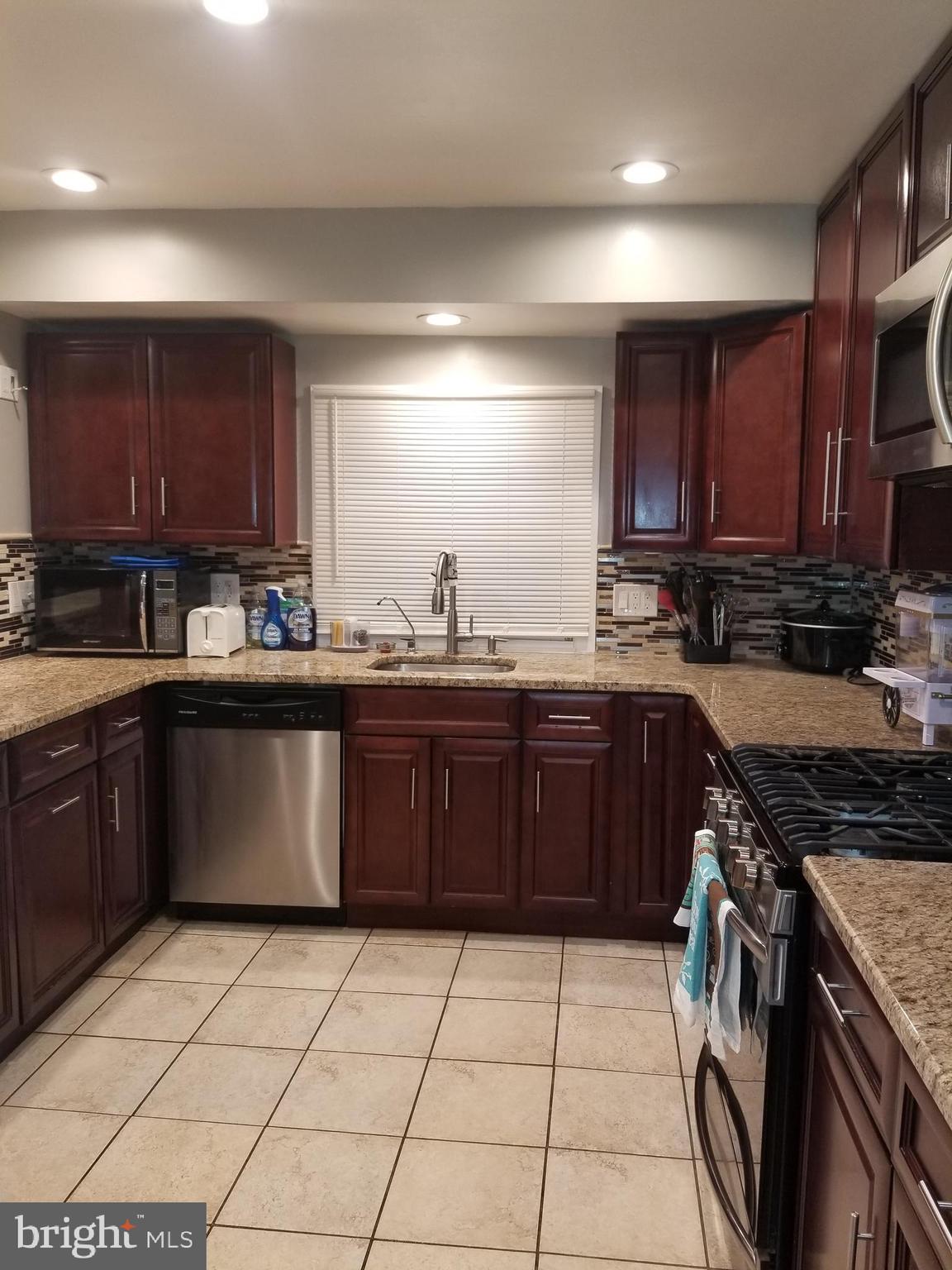 1 Walton Road Mount Holly, NJ 08060 - Photo 30 of 46 a kitchen with a sink a stove and cabinets