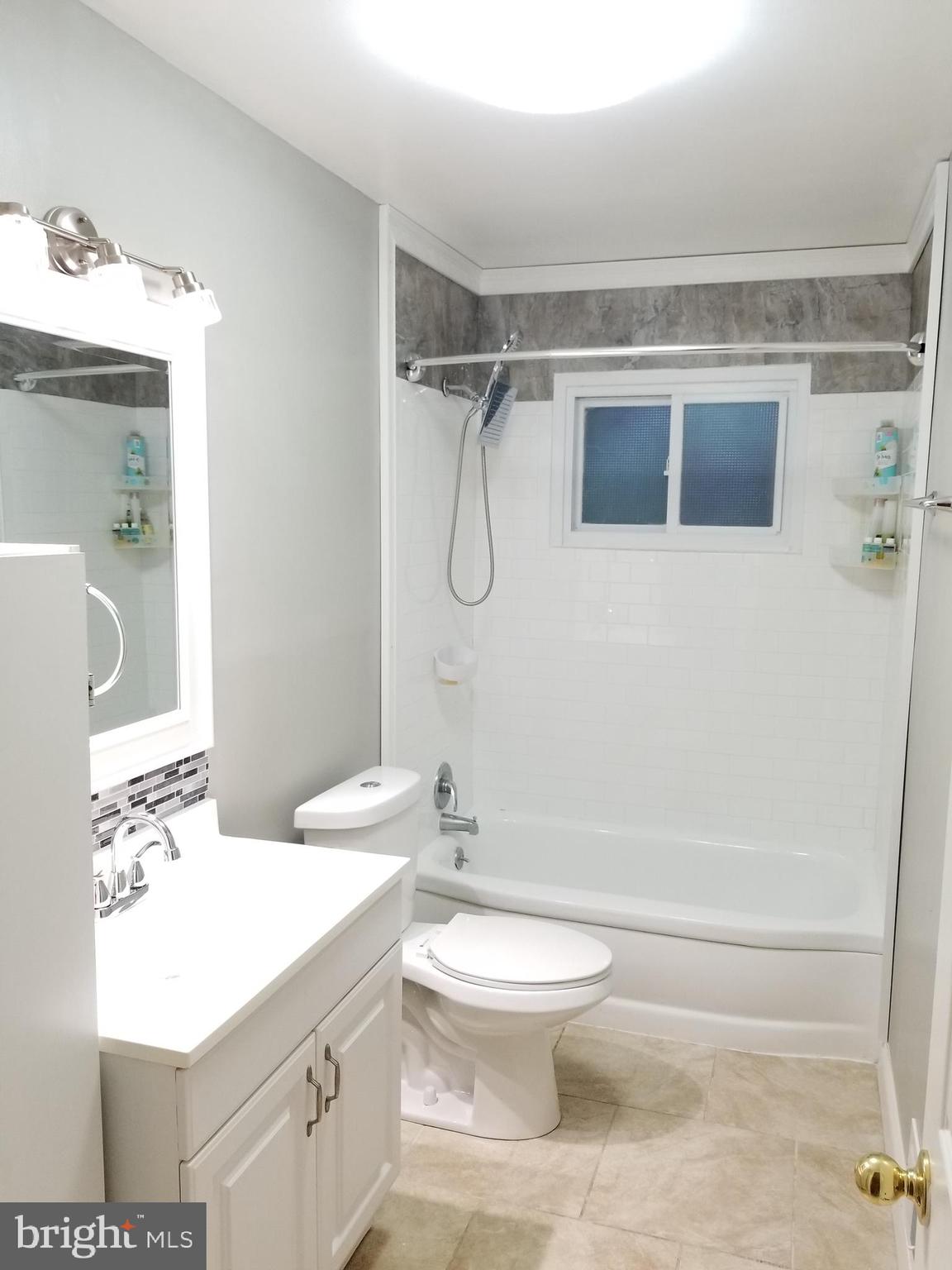 1 Walton Road Mount Holly, NJ 08060 - Photo 32 of 46 a bathroom with a sink a toilet and shower