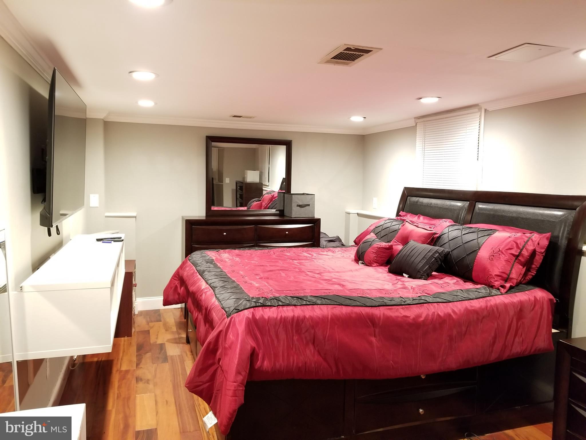 1 Walton Road Mount Holly, NJ 08060 - Photo 40 of 46 a bedroom with a bed and a flat screen tv