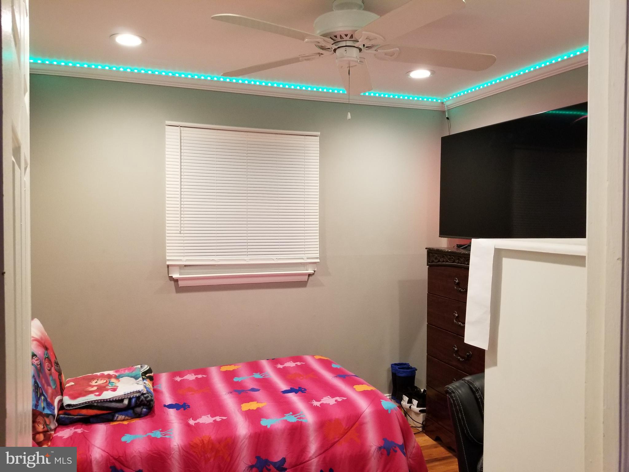 1 Walton Road Mount Holly, NJ 08060 - Photo 45 of 46 a bedroom with a bed and a chandelier