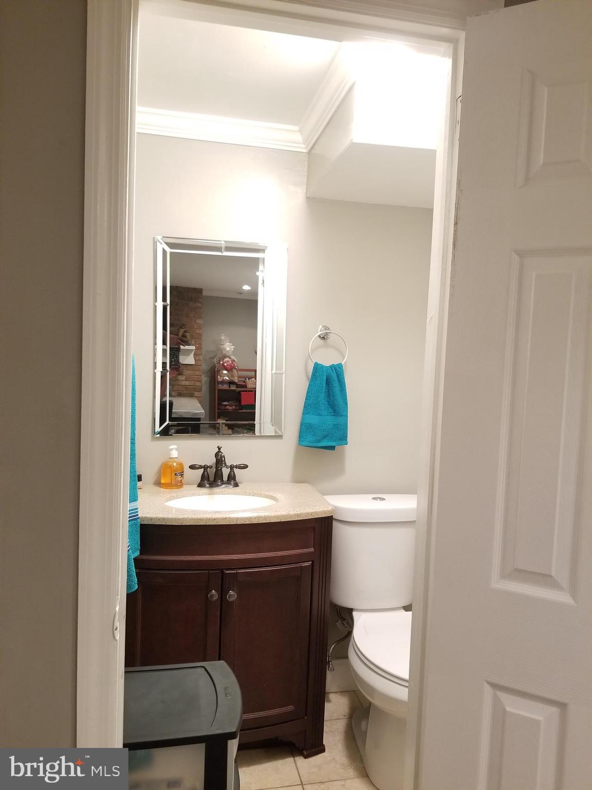 1 Walton Road Mount Holly, NJ 08060 - Photo 46 of 46 a bathroom with a toilet a sink and mirror