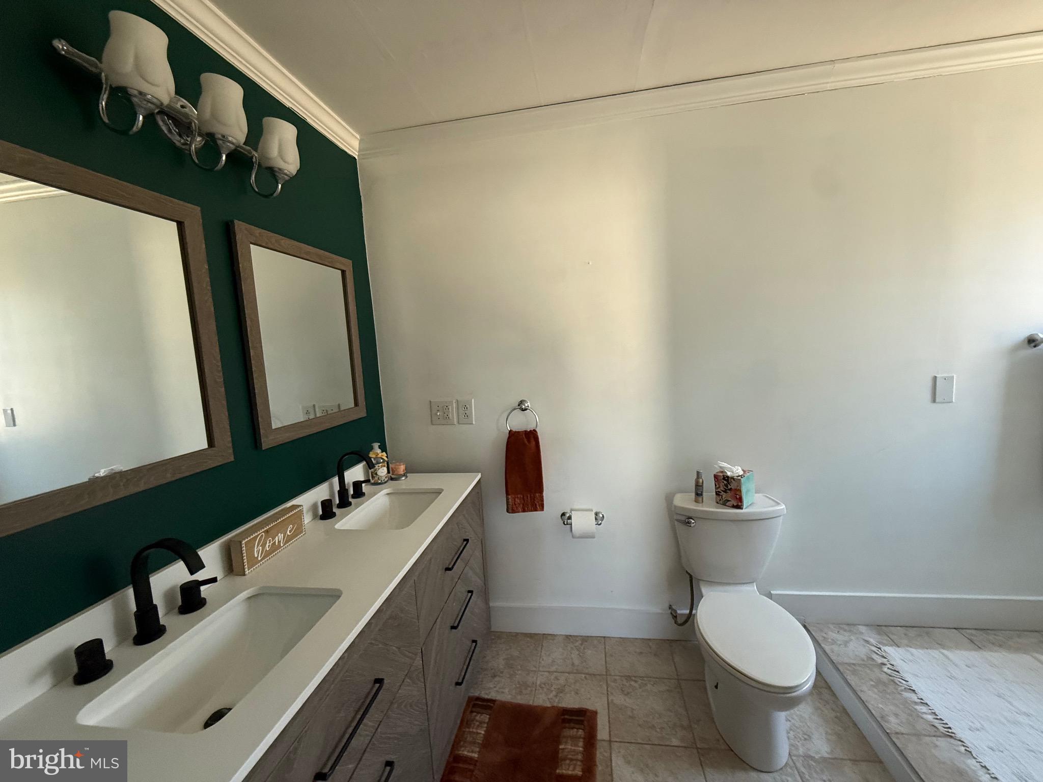 23055 Old Fairlee Road Chestertown, MD 21620 - Photo 14 of 26 a bathroom with a sink and a toilet