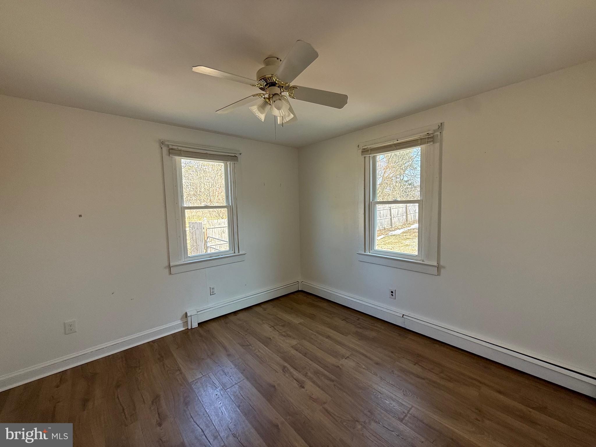 23055 Old Fairlee Road Chestertown, MD 21620 - Photo 21 of 26 a view of an empty room with wooden floor and a window