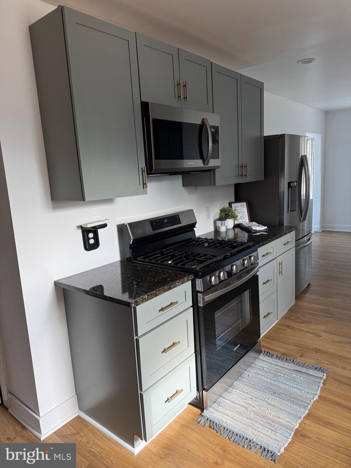23055 Old Fairlee Road Chestertown, MD 21620 - Photo 7 of 26 a kitchen with stainless steel appliances a sink stove and microwave