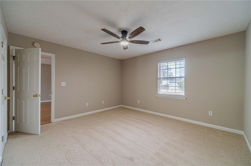 119 West Ash Street Social Circle, GA 30025 - Photo 24 of 44 a view of an empty room with a window