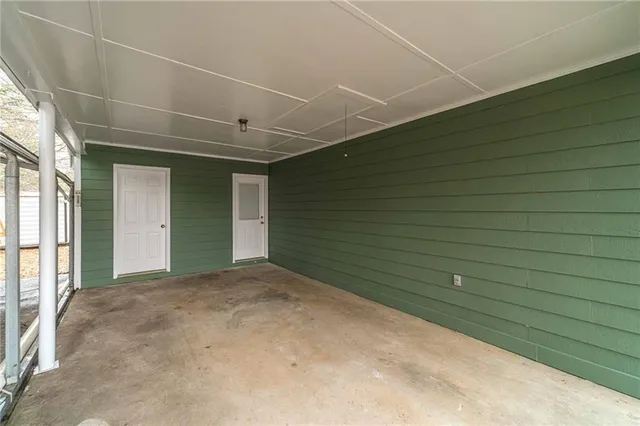 a view of a livingroom with an empty space and a window