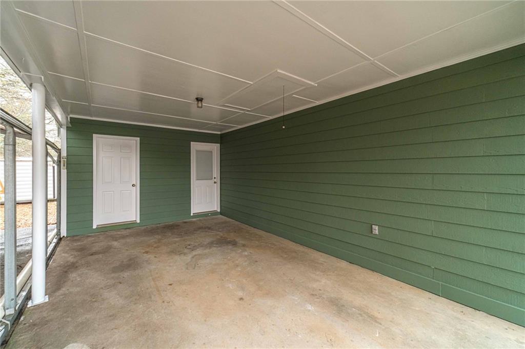 119 West Ash Street Social Circle, GA 30025 - Photo 33 of 44 a view of a livingroom with an empty space and a window