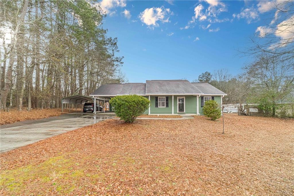 119 West Ash Street Social Circle, GA 30025 - Photo 41 of 44 a view of a house with a yard