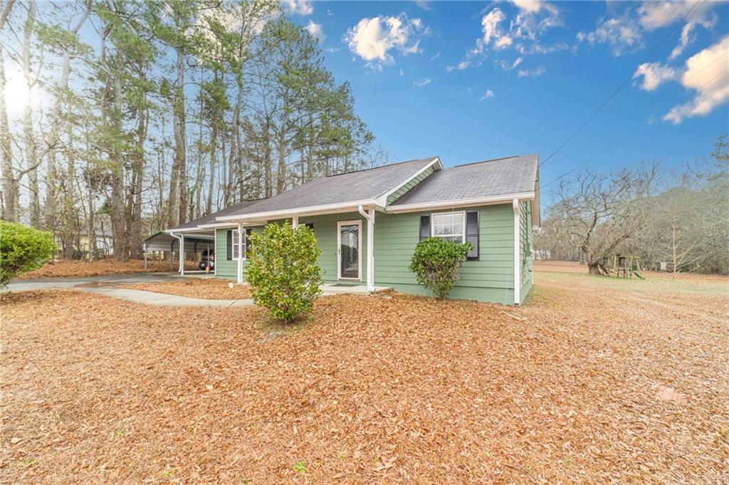 119 West Ash Street Social Circle, GA 30025 - Photo 44 of 44 a front view of house with yard and green space