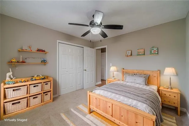 a bedroom with a bed and a closet