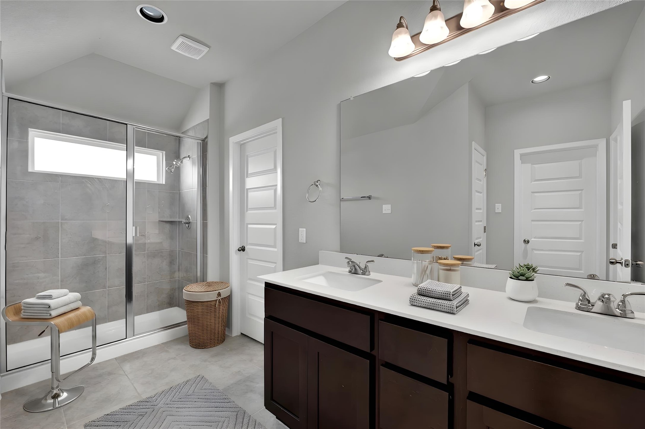 101 Crescent Street Georgetown, TX 78626 - Photo 20 of 39 Primary bathroom features a spacious shower with tile surround and a double vanity.