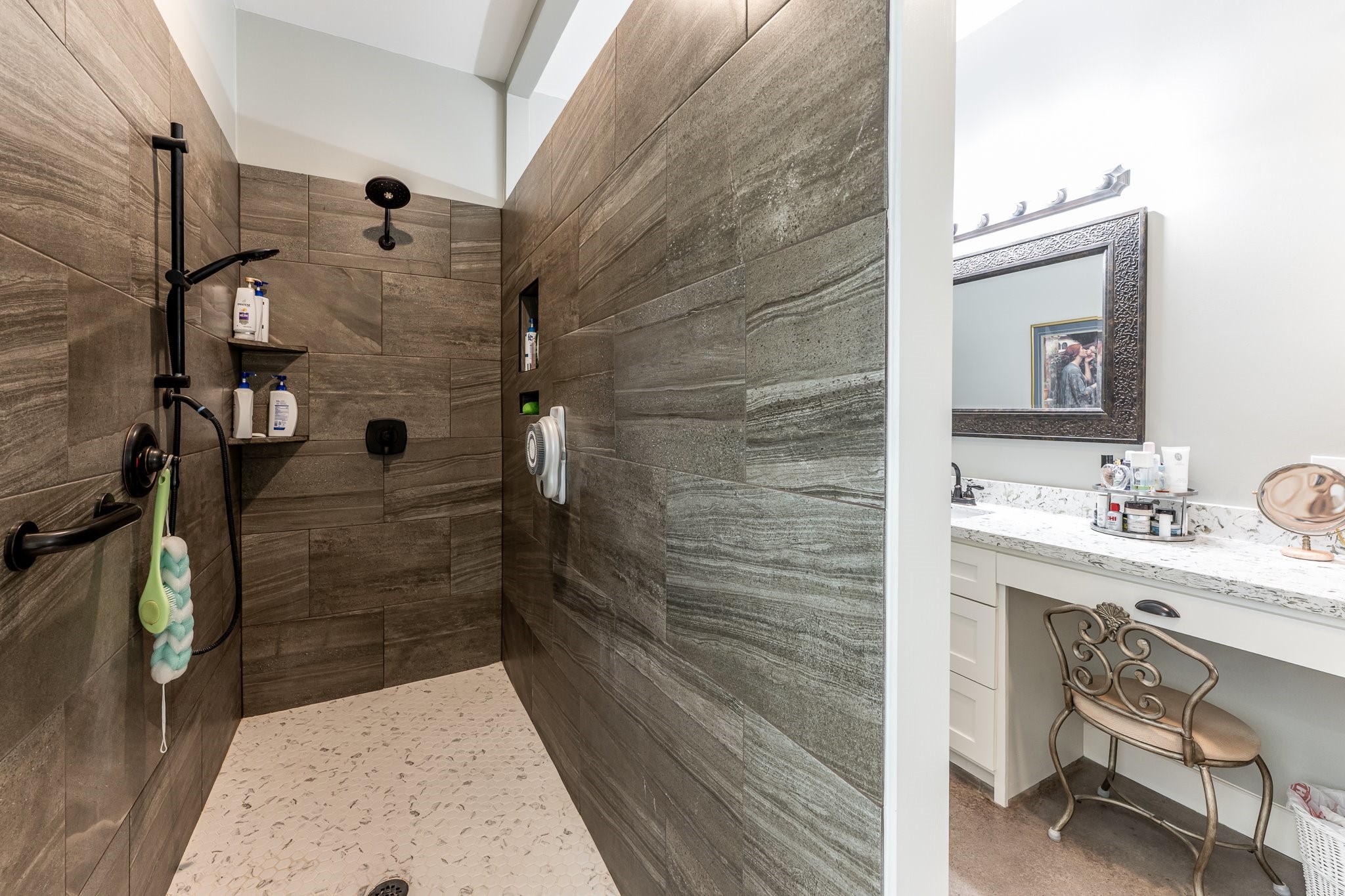 13334 Fultz Road Conroe, TX 77304 - Photo 17 of 49 This oversized, wheelchair-accessible walk-in shower combines sleek design with comfort and ease—perfect for spa days or daily routines.